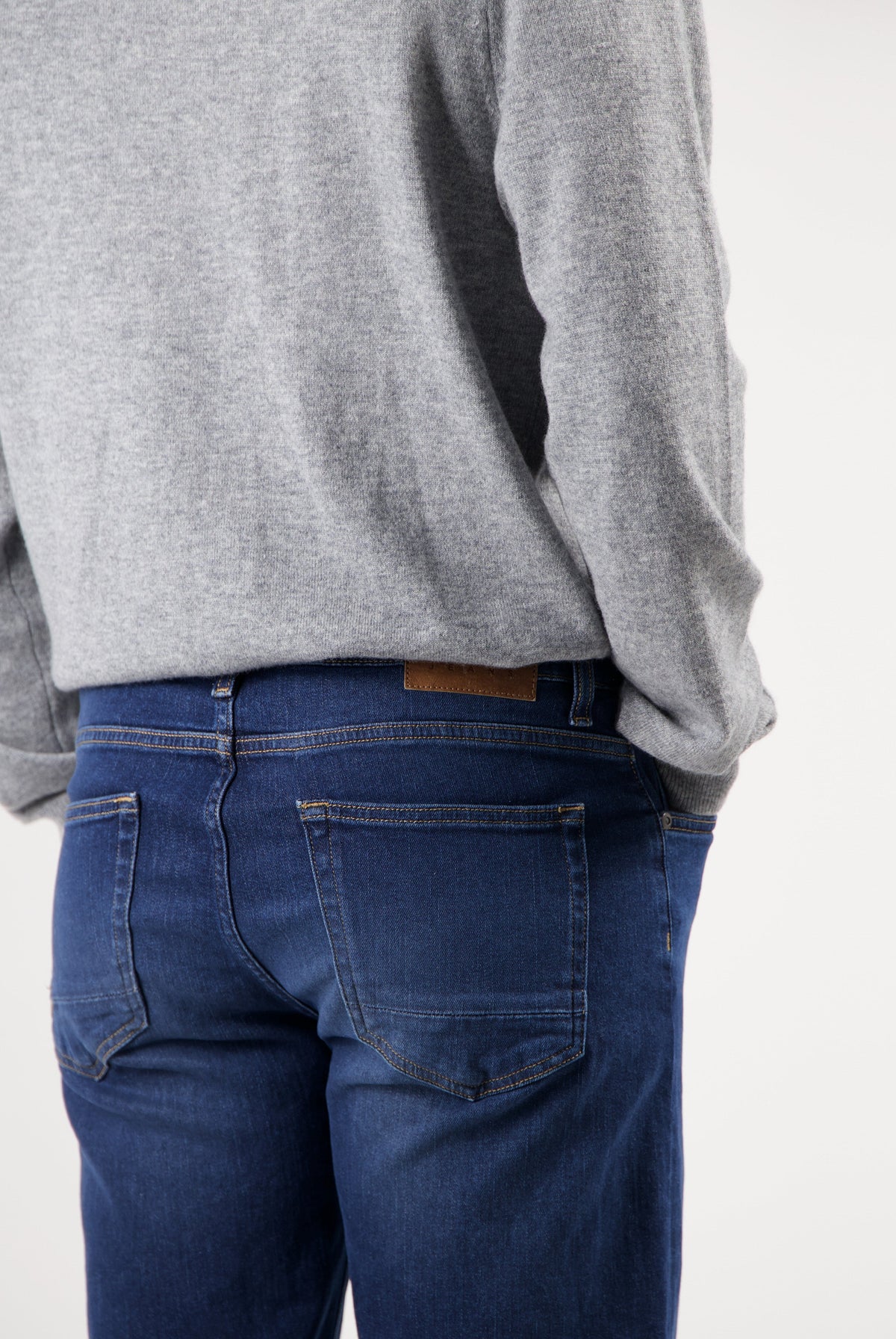 Sustainable MUD Jeans in light blue denim, paired with matching denim jacket, showcasing ethical fashion in classic fit.