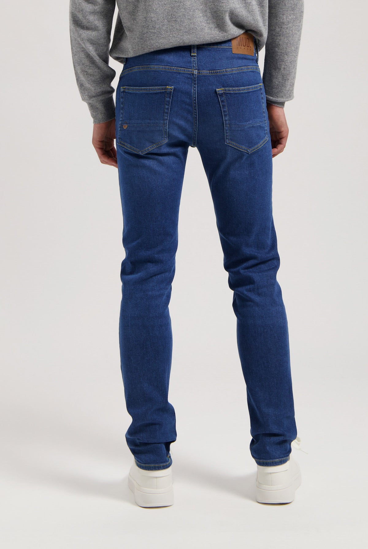 Sustainable MUD Jeans denim jacket and jeans in medium blue wash, showcasing ethical fashion in classic fit.